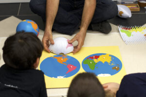 Students looking at planisphere and hemisphere maps